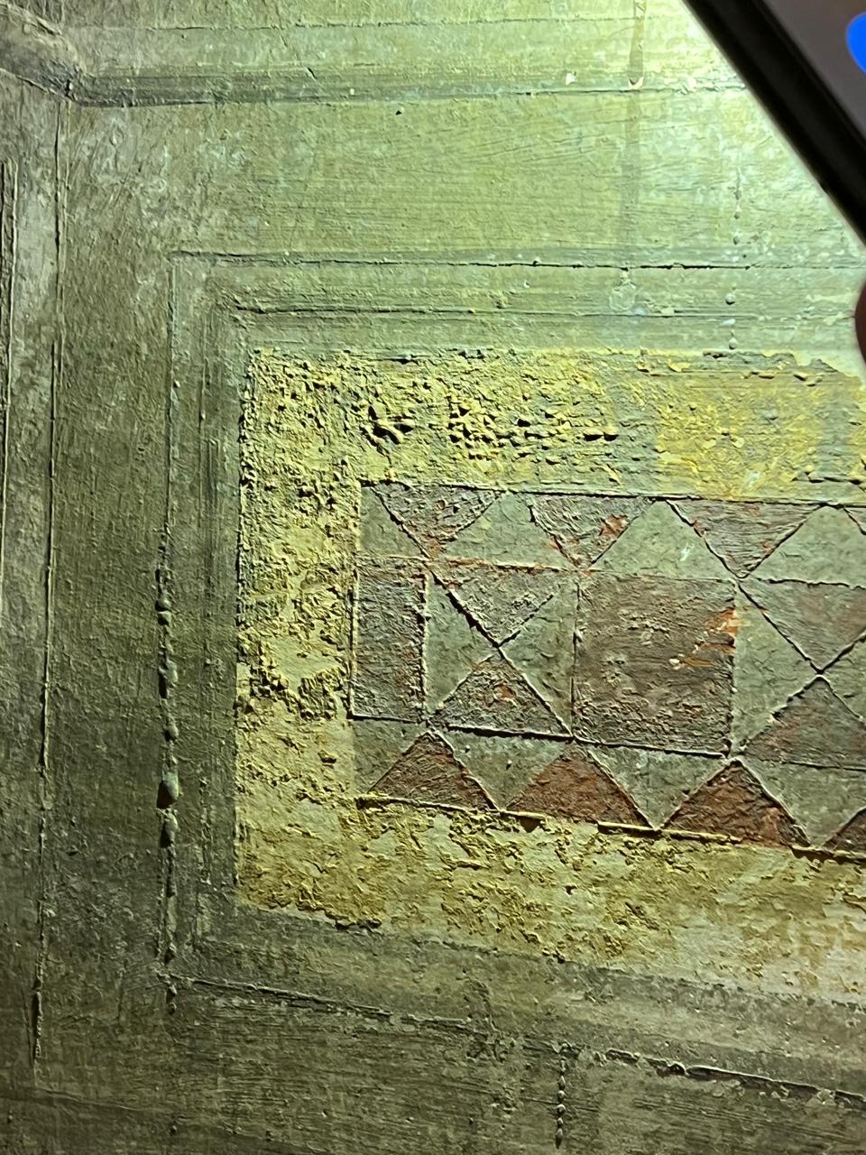 Raking light examination revealing surface texture